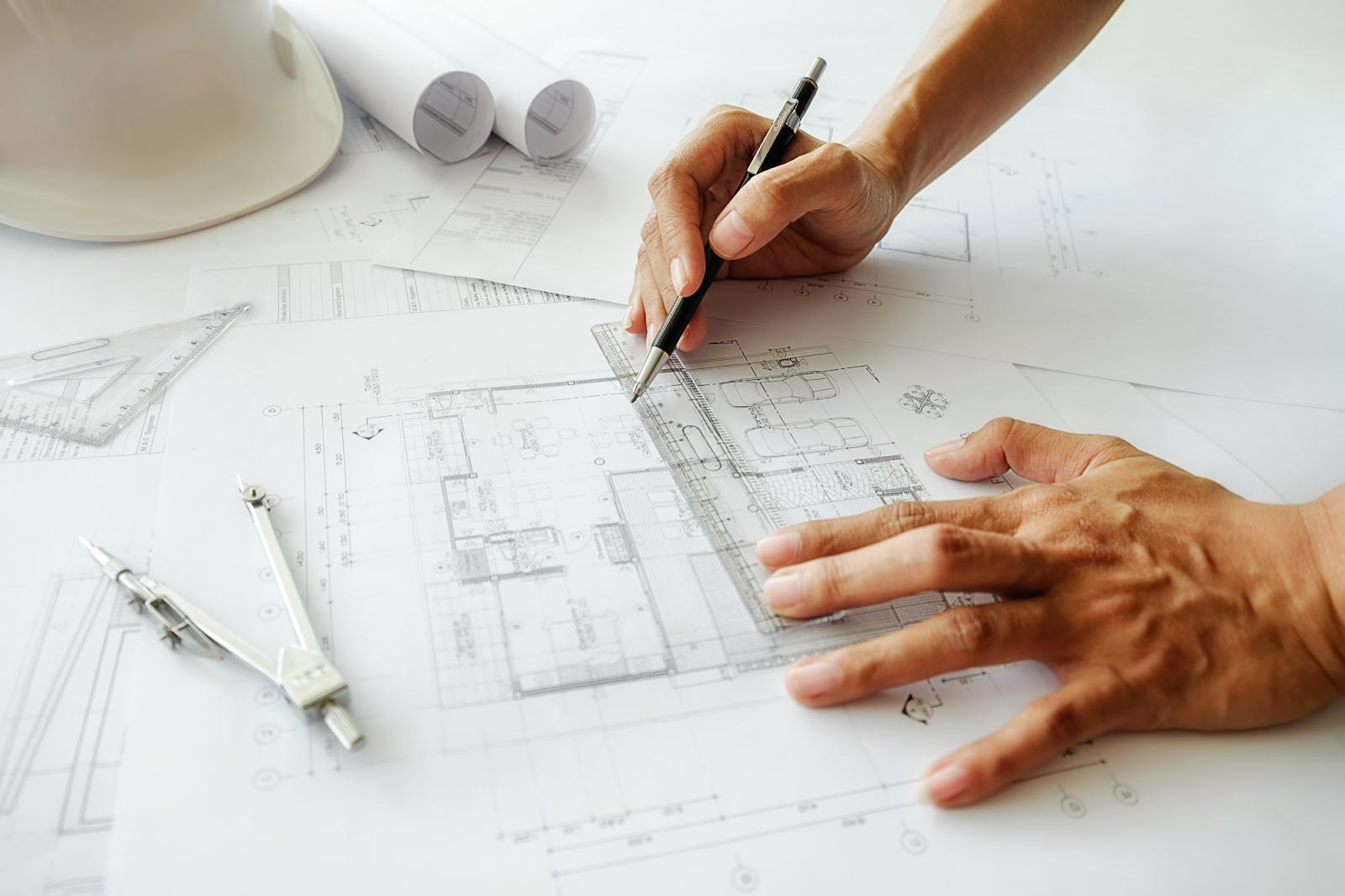 person sketching a floor plan